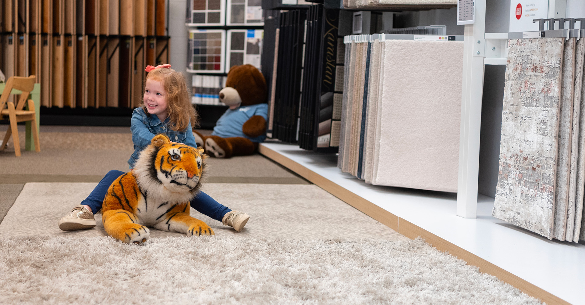 kids playing on newly installed Carpet One vinyl flooring in playroom